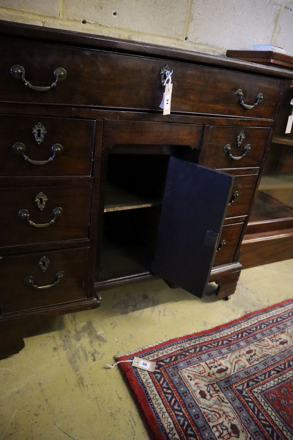 A George III walnut kneehole desk, width 90cm, depth 42cm, height 86cm